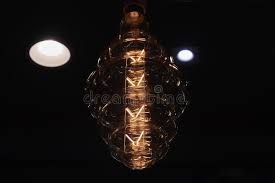 Often style is in the small details. Large Decorative Incandescent Lamp On A Dark Background Numerous Light Sources Are Reflected In A Glass Bulb Stock Image Image Of Reflection Background 163534185