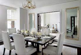 A simple square mirror adds an inviting touch to the bedroom in a modern farmhouse owned by interior designer sean anderson. Contemporary Dining Room