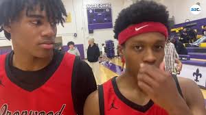 Ironwood coach Jordan Augustine and players I'yar Shadowvine, Kory  Head-Holbrook