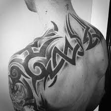 Tribal tattoo designs originating in polynesian cultures are perhaps the most popular choice nowadays. 60 Tribal Back Tattoos For Men Bold Masculine Designs