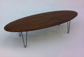 Midcentury oval coffee tables fashioned from wood strike a nice balance, as they'll add warmth to the room without feeling overbearing. Buy Hand Crafted 66 Mid Century Modern Solid Walnut Elliptical Coffee Table Made To Order From Studio1212 Custommade Com