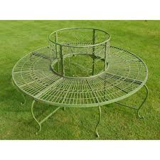 It is made of decorative bent metal with dark brown. Green Round Tree Bench Seat Swanky Interiors