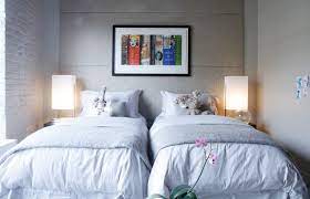 13 tricks that squeeze every inch out of a. How To Decorate With Twin Beds