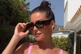 British boxing legend's model wife told to 'behave' after sharing stunning  pics in Barbie swimsuit with fans