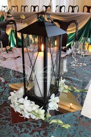 Use these console table decor ideas to style the perfect arrangement in your home. Pin By Rachel Adams On Eric And Aud Wedding Ideas Lantern Centerpieces Lantern Centerpiece Wedding Wedding Centerpieces