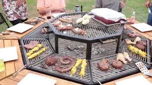 Social Grilling Communal Bbq Table Lets Everybody Cook Their Own Food Bbq Table Communal Cooking Restaurant