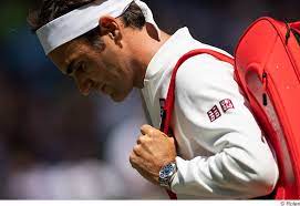 Rolex ambassador caroline wozniacki hoists the women's trophy wearing a rolex daytona. Portrat Rolex Markenbotschafter Roger Federer