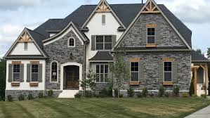 White brick house with wood shutters. Exterior Shutters Outdoor Shutters Advantage Shutters
