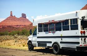 Red danish falck wrecker truck pulling a broken down bus. School Bus Conversion Bathrooms Toilet Shower And Plumbing Guide