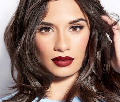Dark thick curly hair worn naturally; Burgundy Hair Red Lipstick Novocom Top