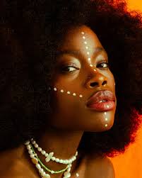 Beauty Marks • On our skin's canvas, tales unfold, Beauty marks reveal  stories of old. Like tiny constellations, etched with grace, Each mark  whispers, a unique embrace. Amidst faces, they softly shimmer,