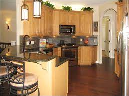 If you're looking to make a statement with your kitchen renovation, black countertops are a perfect solution. Shadow Woods Delivers Honey Oak Cabinets Light Oak Cabinets Kitchen Flooring