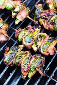 Delicious Grilled Bacon Wrapped Brussel Sprouts On A Skewer This Easy Side Dish Is Perfect For Throwing On The Sprout Recipes Grilled Side Dishes Bbq Recipes