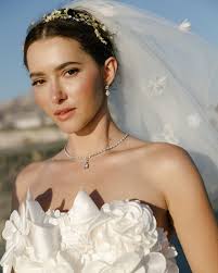 For months leading up to the wedding, @madeleinecwhite—a TikToker known for  DIY-ing her own outfits, including turning a Prada jumpsuit into a crop top  and miniskirt—chronicled the highs and lows of her