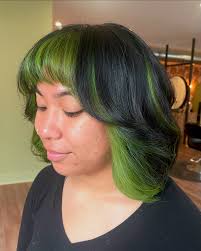 Ivy green peak-a-boo + a layered bouncy bob = a match made in heaven! Had  so much fun doing this placement! 💚⁣ Book your color consultation now and  make your hair dreams