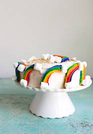 Rainbow Cake Recipe With Marshmallow Clouds And Gold Sprinkles