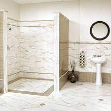 The bathroom tile ideas in the picture creates a clear separation between the floor and wall. Bathroom Tile Designs For Small Bathrooms Novocom Top