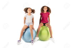 See more ideas about hair, hair styles, long hair styles. Two Young Playful Children Or Pre Teen Biracial Girls With Brown Curly Hair Playing Or Exercising On Large Rubber Balls Stock Photo Picture And Royalty Free Image Image 99510406