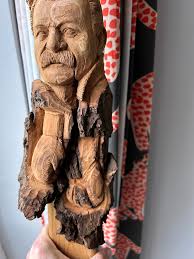 Carving in cottonwood bark, 4.5" wide and 18" long