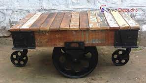The top is made out of reclaimed wood from the era, so has a rich, dark, wonderful patina to it. Hot Selling Industrial Vintage Wood Metal Cart Coffee Table With Wheels Buy Industrial Cart Coffee Table With Wheels Vintage Wood Metal Cart Coffee Table With Wheels Hot Selling Coffee Table With Wheels Product