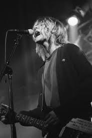 He was known for his cryptic lyrics. Kurt Cobain S Grunge Style In 12 Vintage Photographs Kurt Cobain Style Kurt Cobain Photos Kurt Cobain