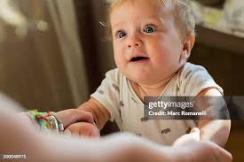 Caucasian Baby Gasping At Mother High-Res Stock Photo