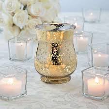 These decorative rose gold candle holders are sure to add a touch of glamour to your wedding. Gold Mercury Hurricane Glasses Gold Mercury Glass Centerpiece Wedding Centerpieces Mercury Glass Centerpiece