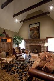 Brick Fireplace With A Wooden Beam Mantel A Cathedral Ceiling With Decorative Wooden Beams And Hardwood Flooring Brick Fireplace Fireplace Great Rooms