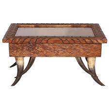 The table is 40 long x 24 wide x 17 high and is made from red oak. Rustic Tables Large Horn Collection Shadow Box Coffee Table