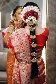 This simple braid can be made a perfect wedding reception hairstyle in an easy and quick yet charming way. Floral Hairstyles Every Indian Bride Needs To Check Out The Wedding Brigade Blog