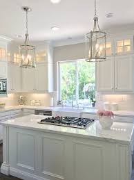 White Kitchen With Danby Marble And Subway Tile Backsplash With Small Cabinets Added On Top Exi White Kitchen Remodeling Kitchen Cabinet Remodel Kitchen Layout