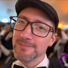 Hello, hivemind! I need some help coming up with some way to involve a  players backstory into the narrative. His character is a gold dragonborn  who is descended from royalty but now