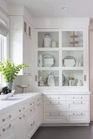 White Drawers Donning Satin Nickel Pulls And A White Quartz Countertop Are Fitted Beneath Bu Kitchen Cabinet Design Kitchen Cabinet Layout New Kitchen Cabinets