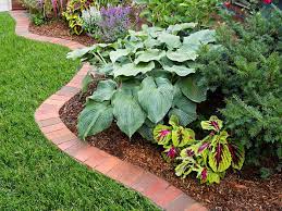 Brick pavers are inexpensive and create a nice division between your lawn and flower beds. Brick Garden Edging Beautify Your Outdoor Space In 12 Steps This Old House
