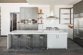 Silver Grey Cabinets And A White Kitchen Island With A Cuboard Inside A Spacious Kitchen With W In 2020 Kitchen Backsplash Designs Gray And White Kitchen Grey Kitchens