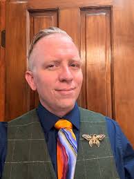 Blue-jean, orange polo, olive green outfit ideas