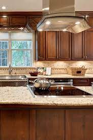 Giallo Rio Granite Countertop Dark Brown Cabinet Cream Travertine Backsplash 2 In 2021 Granite Countertops Kitchen Brown Granite Countertops Brown Kitchen Cabinets