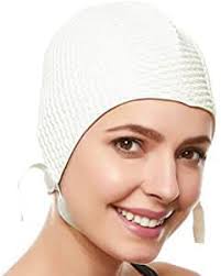 Rubber bathing caps in swimming pools during the 50's, 60's, and 70's