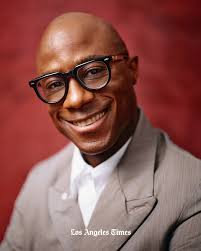 The young boy looked sharp, decked out in an orange-brown suit. His warm  smile gave