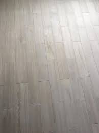 Lowe S Eldon White Wood Look Porcelain Tile With Silver Grout From Menards Woodflooringoutdoor Flooring Wood Look Tile Floor Wood Look Tile