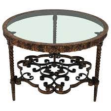| skip to page navigation. Wrought Gilt Iron Smoked Glass Round Coffee Table Twisted Legs And Floral Motif For Sale At 1stdibs