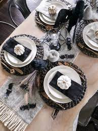 A black and white color scheme with rich purple accents is sleek and dramatic. Black And White Halloween Table Decorations Taryn Whiteaker