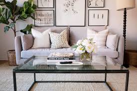 Simple coffee table decorating ideas offer wonderful ways to give living room designs a fresh feel and a universal appeal. How To Style A Coffee Table The Everygirl