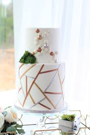 The first step to selecting a wedding cake is determining the overall feel or theme of your wedding day so that the cake design goes with the aesthetic you're going for. Wedding Cakes Charity Fent Cake Design
