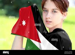Young girl holding the flag of Jordan close up Stock Photo