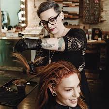 Young woman having haircut at beauty salon. The Best Hair Stylists In Philadelphia