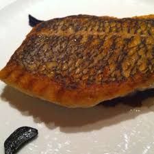 Signature Dish From Executive Chef Ericripert At Le Bernardin Restaurant Un Nyc Crispy Black Bass W Black Garlic Persia Recipes Black Garlic Signature Dishes