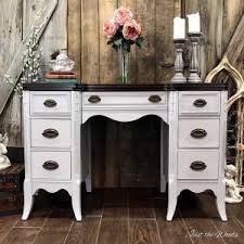 2.75 x 2.75, bottom of leg 1.5 x 1.5 5/16 threaded bolt size (industry standard) Gray Painted Desk With Espresso Stain Top By Just The Woods