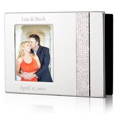 A personalized bottle of whiskey and flask make a great groomsmen gift. Personalized Wedding Photo Albums Customized Wedding Albums