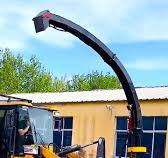Backhoe Loader with Mowing Platform Innovations